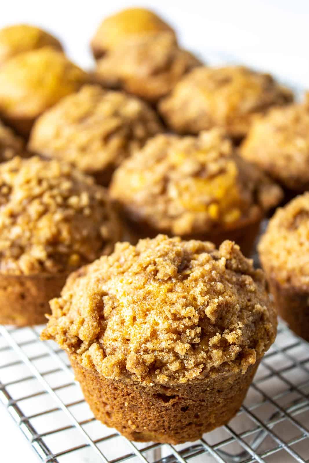 Pumpkin muffins on a baking rack.