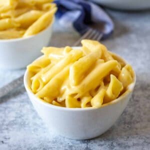 Stove top mac and cheese in a small white bowl.