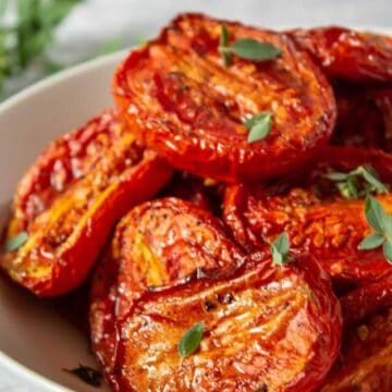 Roasted tomatoes with fresh herbs.