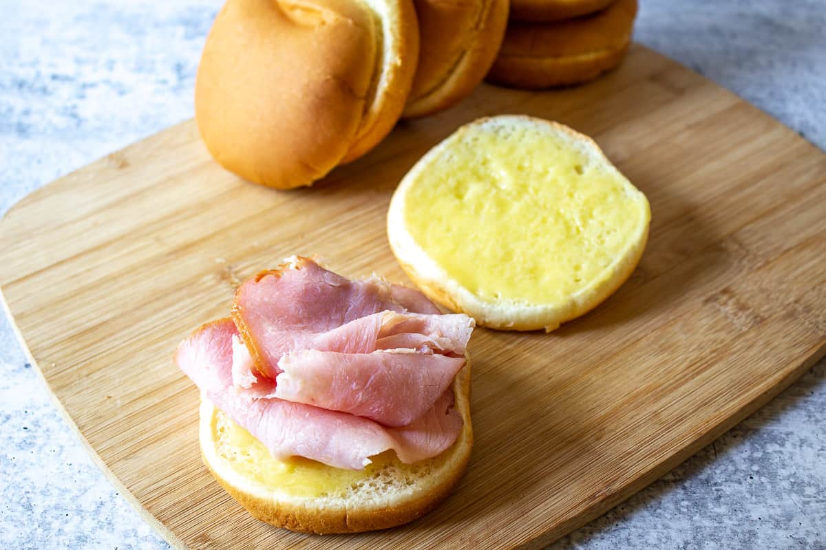 Slices of ham on a hamburger bun.