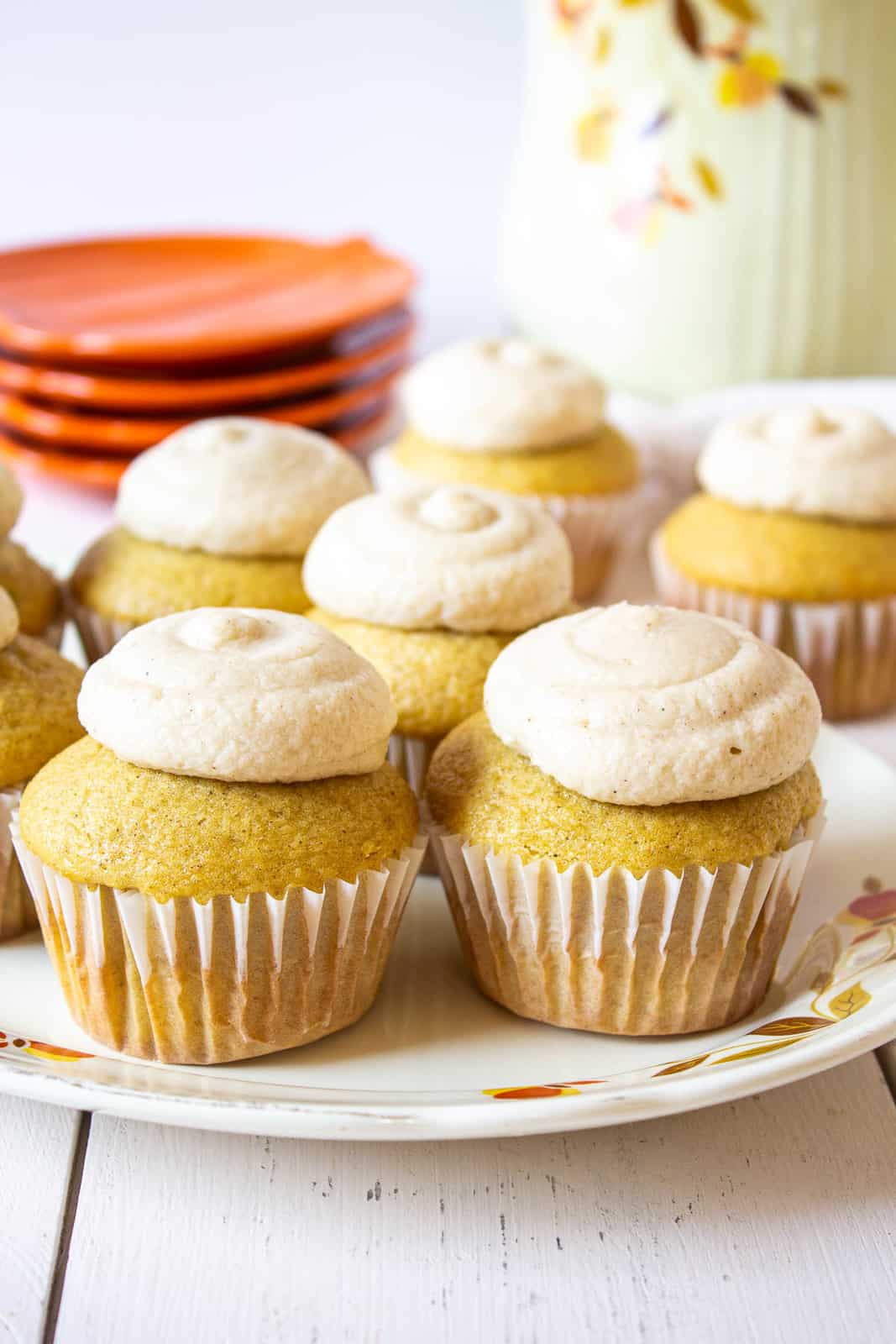 Cupcakes topped with frosting on a plate.