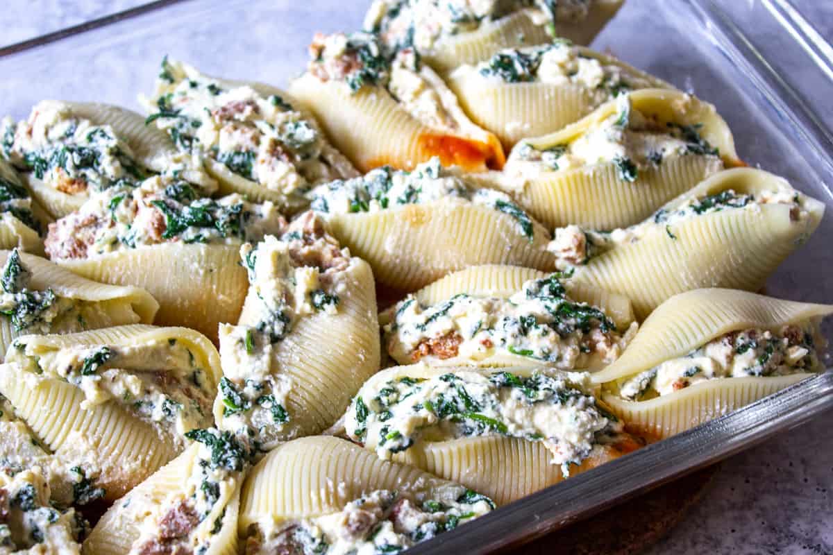 Stuffed shells in a baking dish.