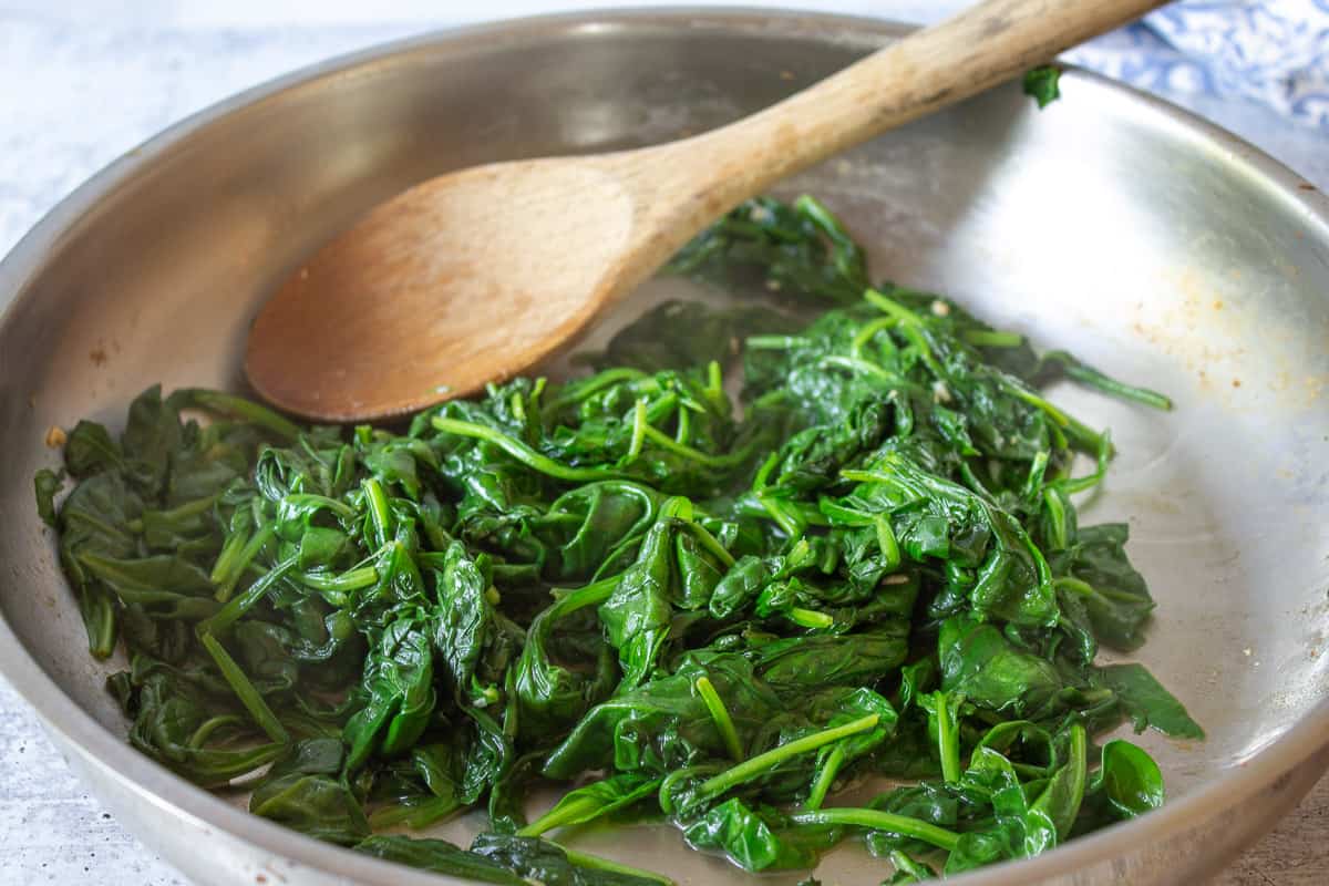 Spinach that has been cooked down and wilted.