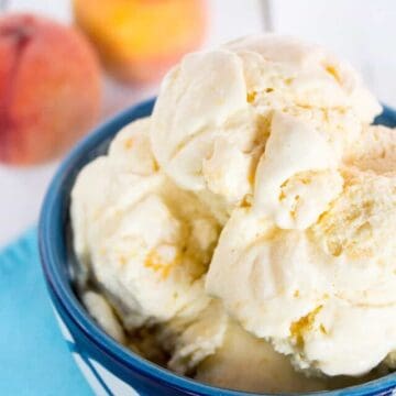 Scoops of ice cream in a blue and white bowl.