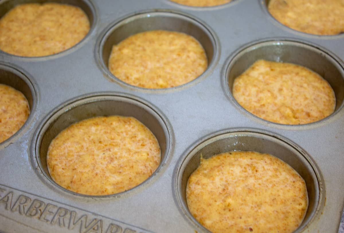 Batter in a muffin tin.