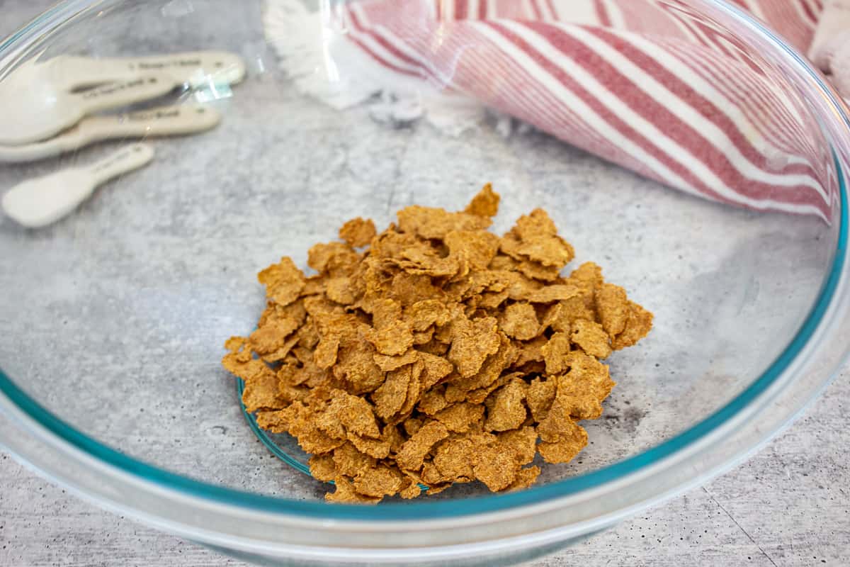 Bran flake cereal in a glass bowl.