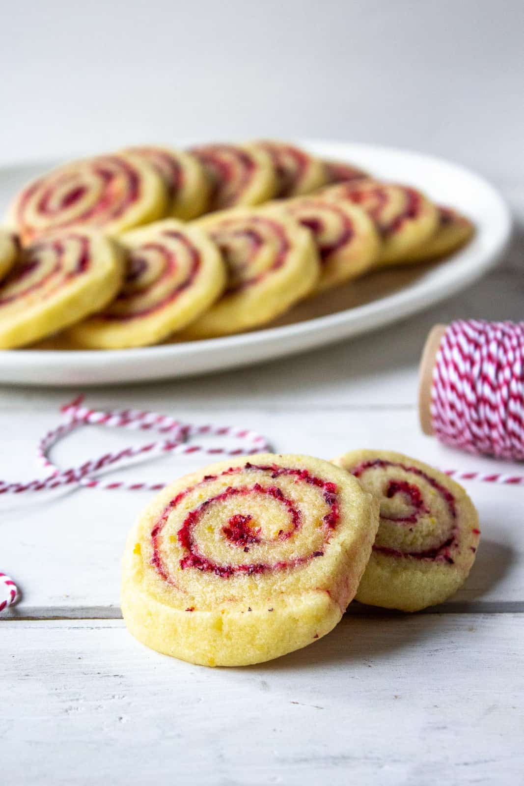 Orange cranberry cookies on a plate. 