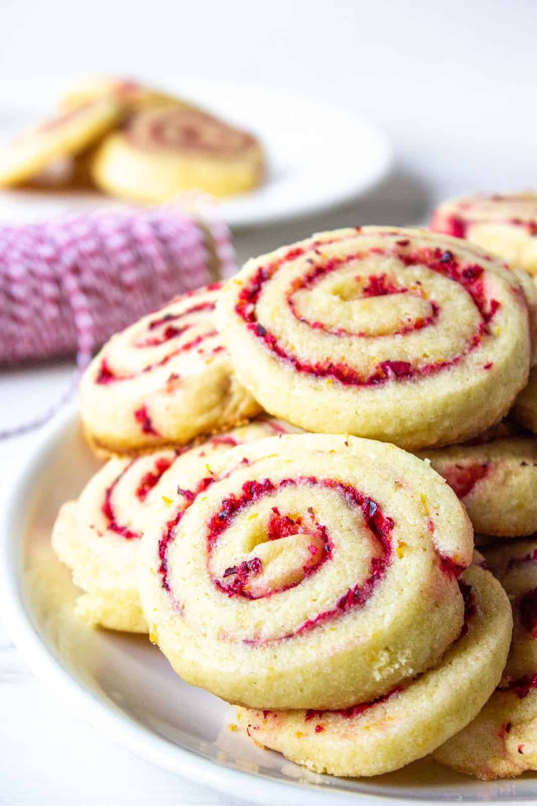 Cranberry orange cookies on a white plate.