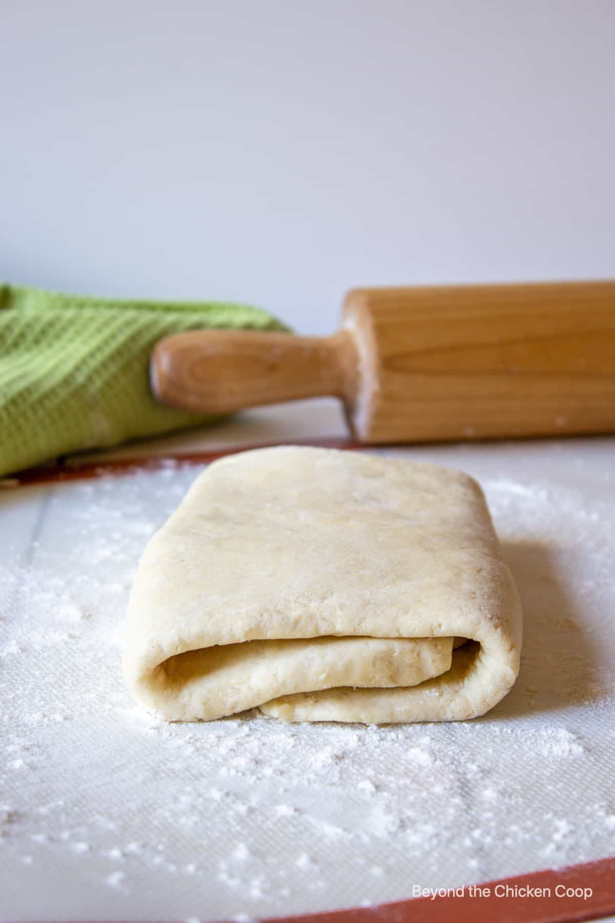 Puff pastry dough on a floured board.