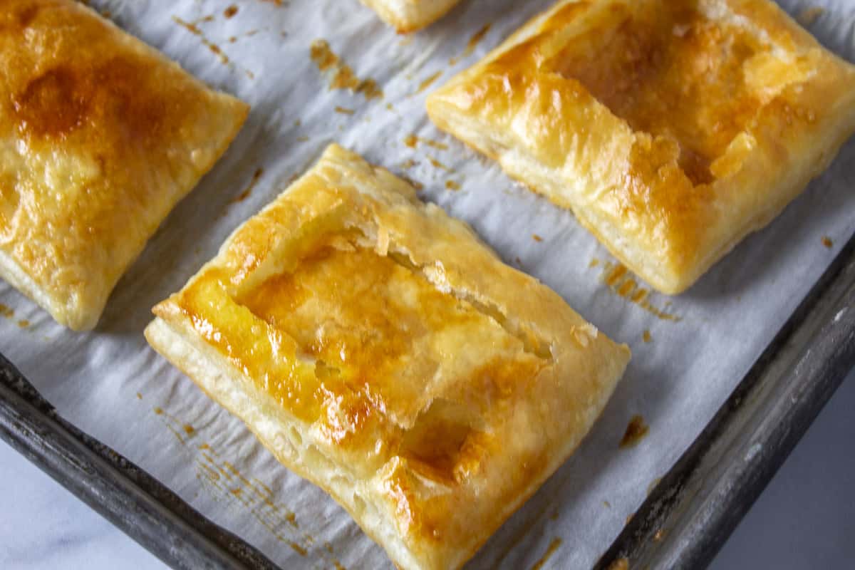 A puff pastry shell with the center pushed down.