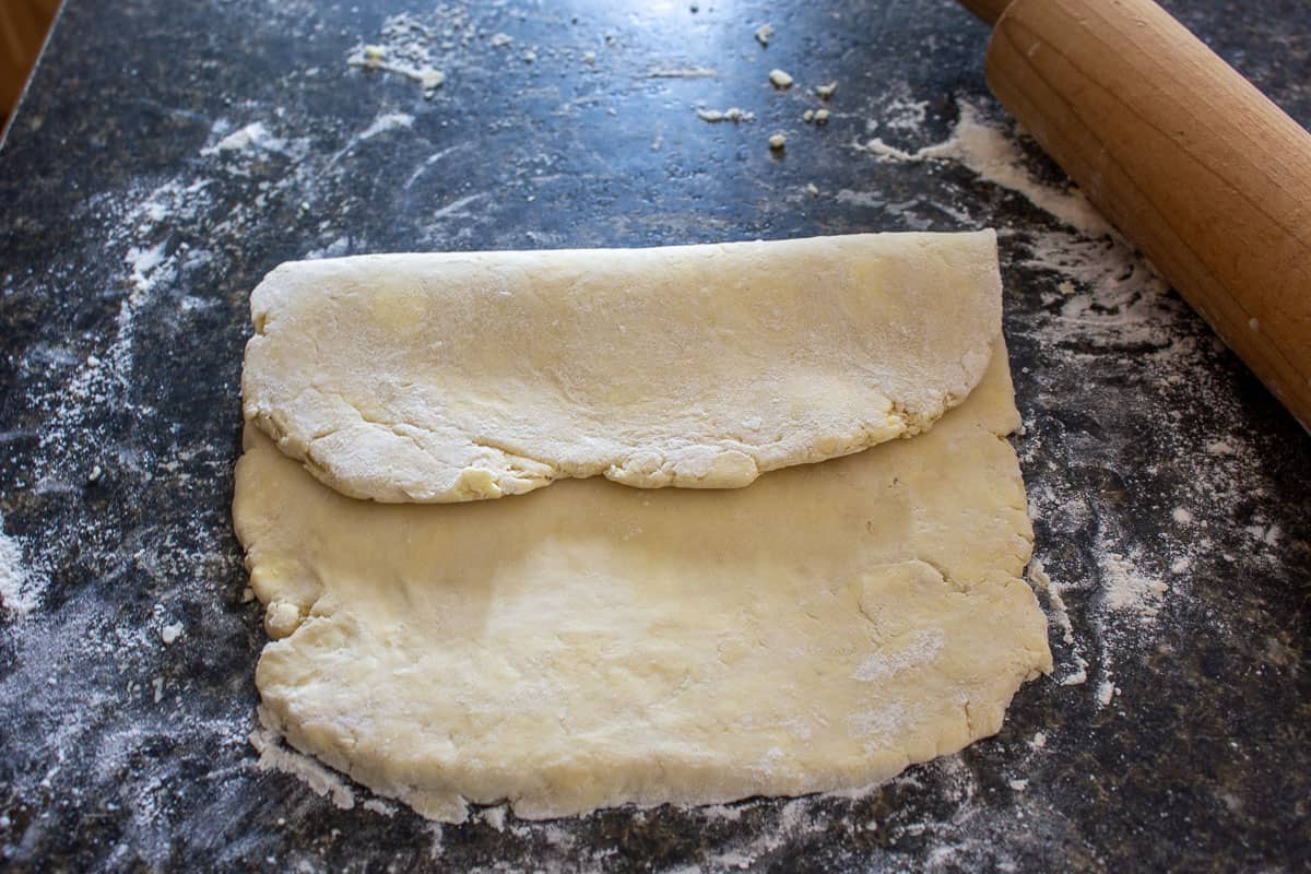 Puff pastry dough folded over part way.