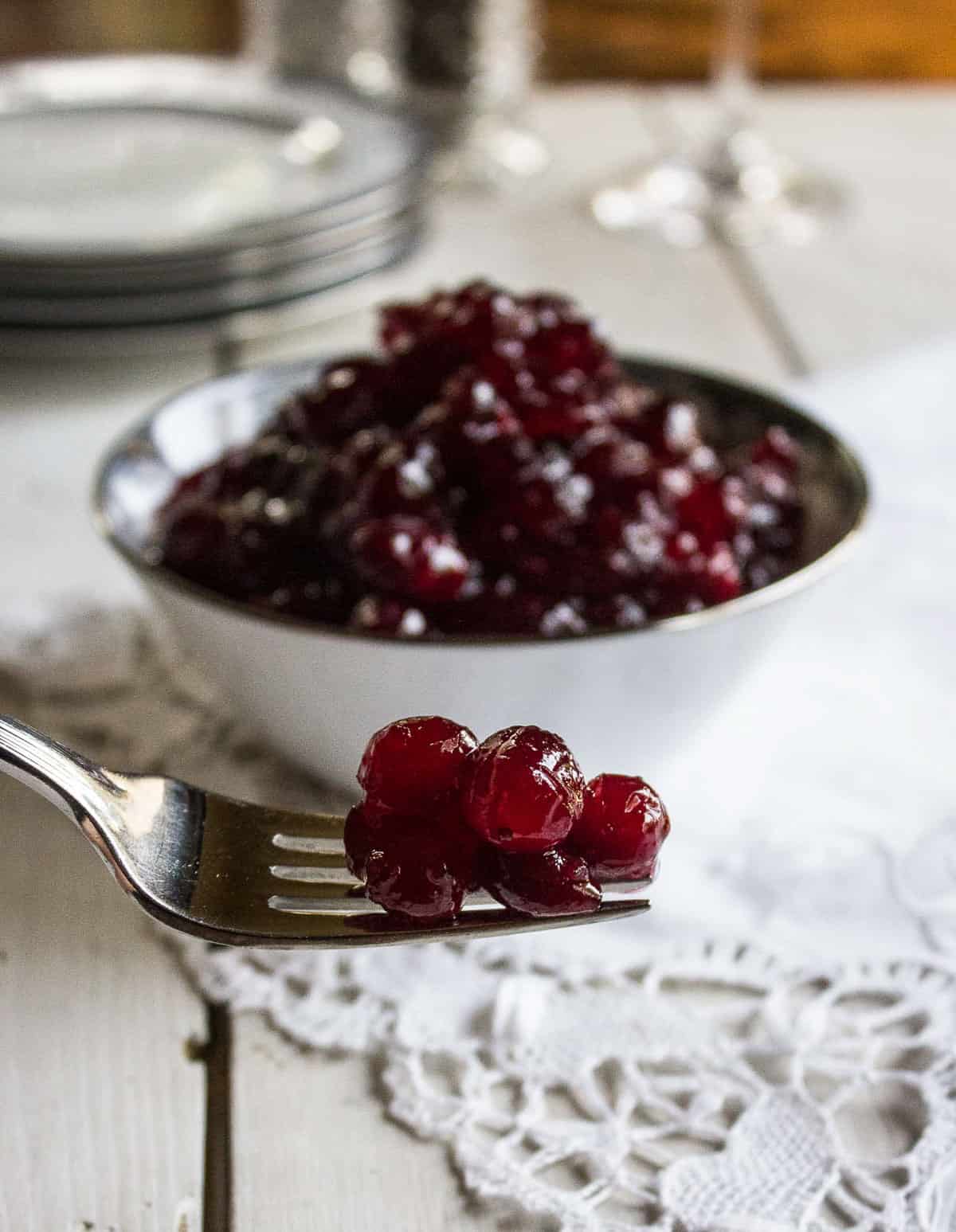 A fork with a bit of cranberry sauce on the tines.