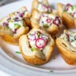 Puff pastry filled with cream cheese, cranberries and jalapenos.