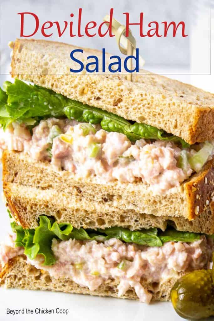 A sandwich filled with finely chopped ham with mayonnaise and lettuce.