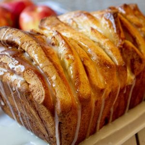 A loaf of pull apart bread with a glaze.