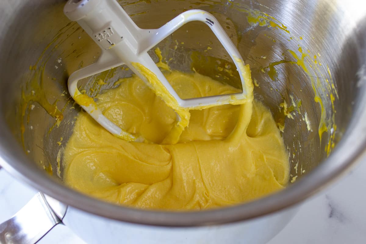 A yellow batter in a mixing bowl.