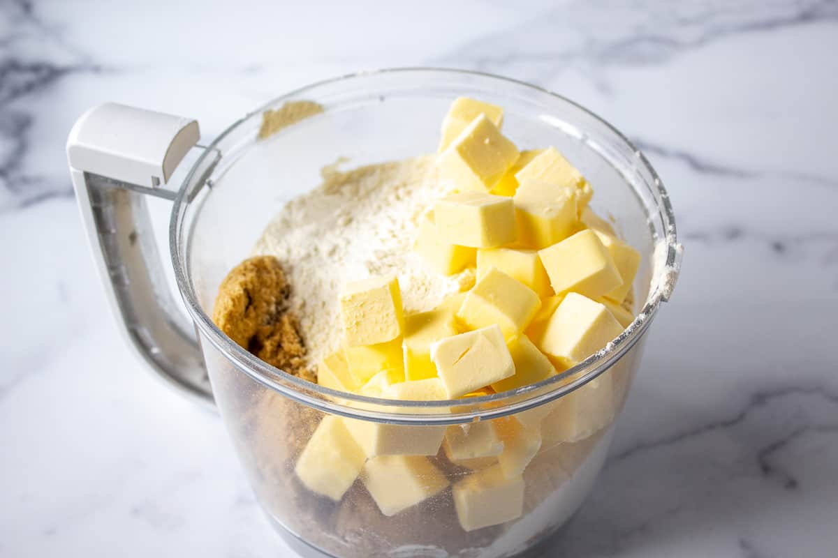 Butter and flour in a food processor bowl.