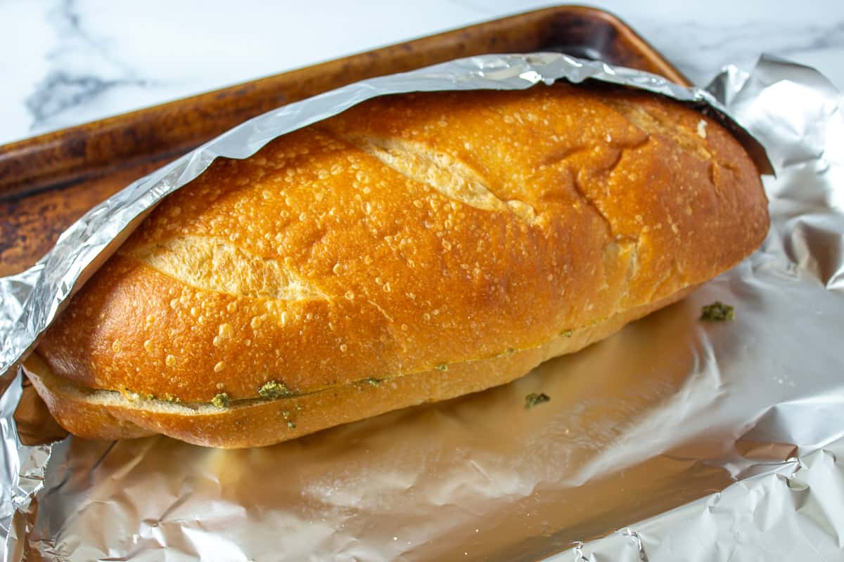 French bread being wrapped with foil.