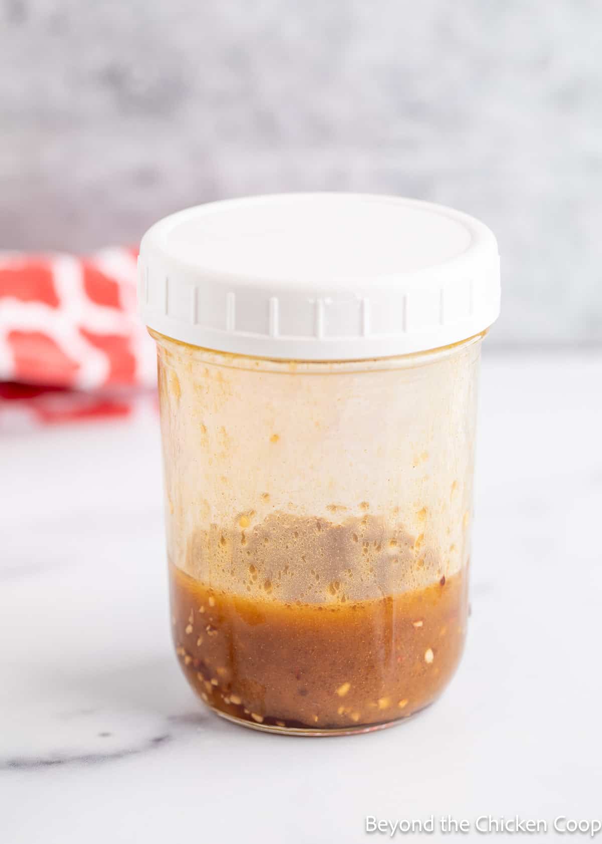 A homemade dressing in a canning jar. 