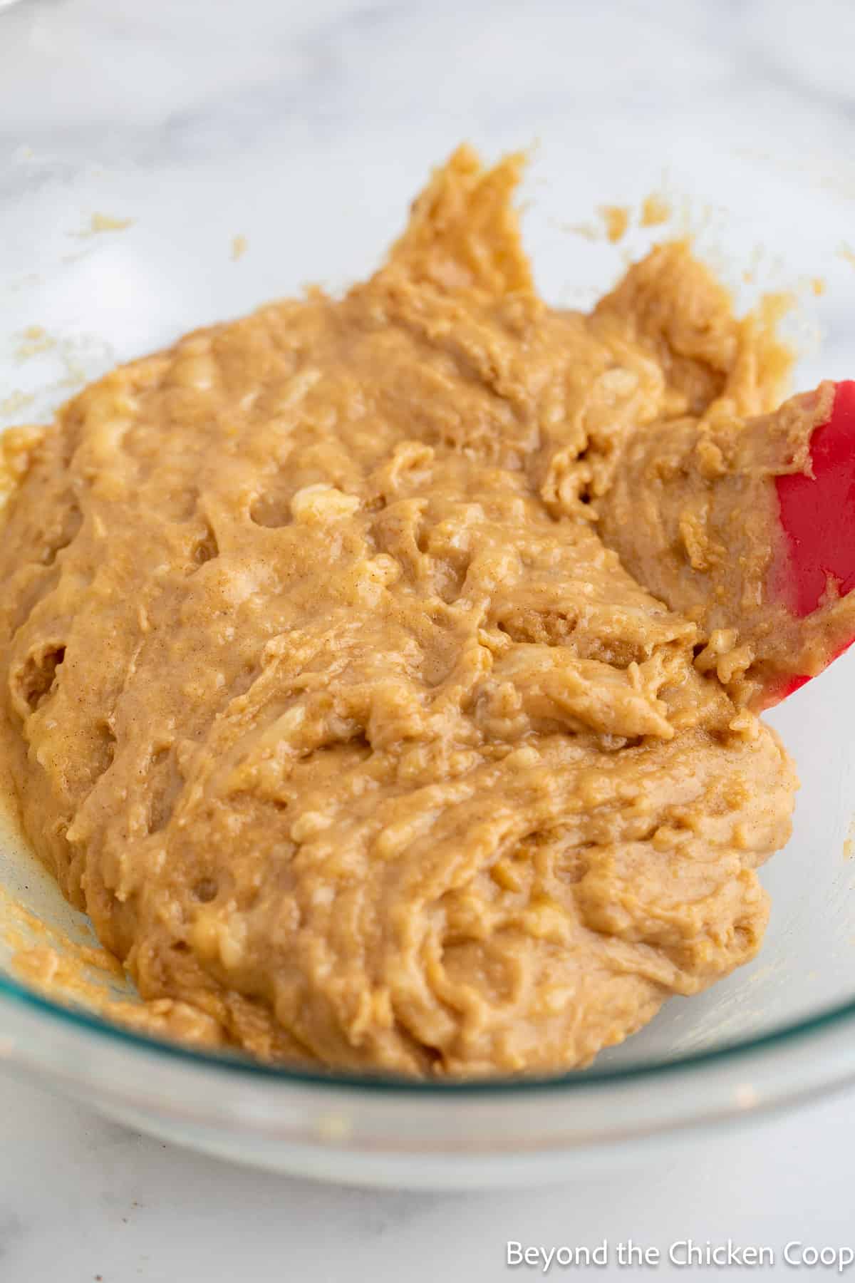 Banana muffin batter in a bowl. 