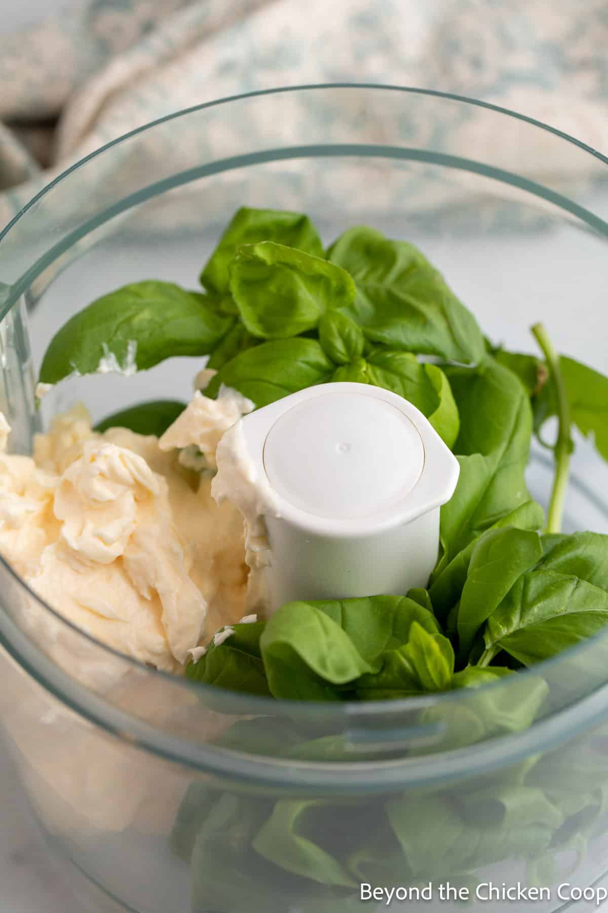 Basil and mayo in a food processor.