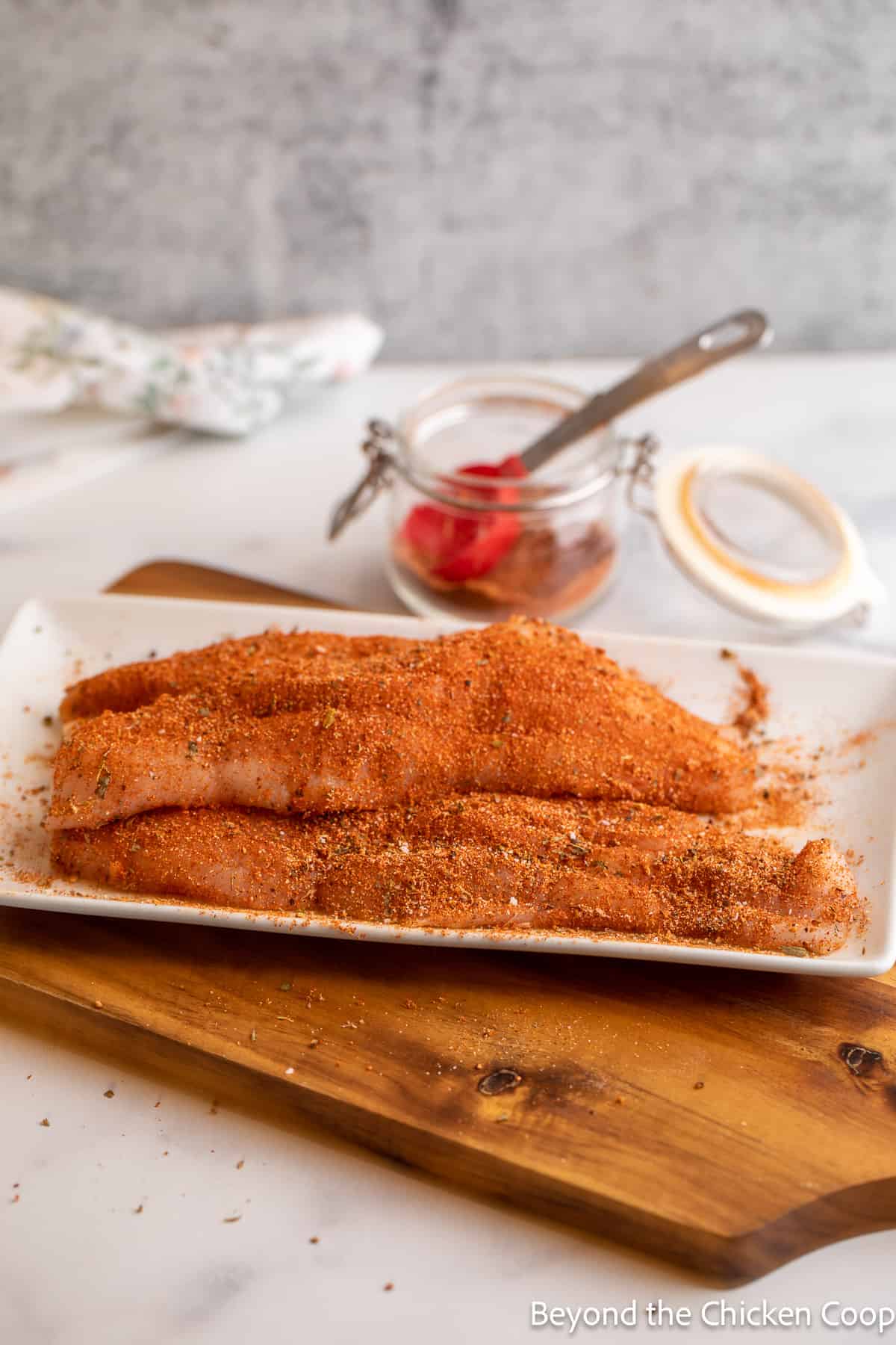 Fish fillets covered in seasoning. 