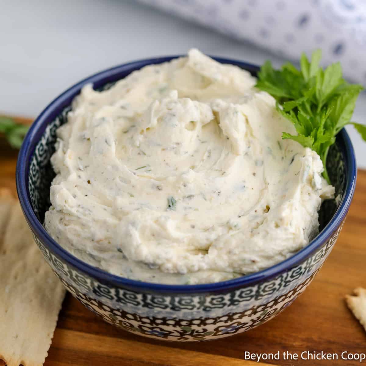 Homemade Boursin Cheese in a blue patterned bowl. 
