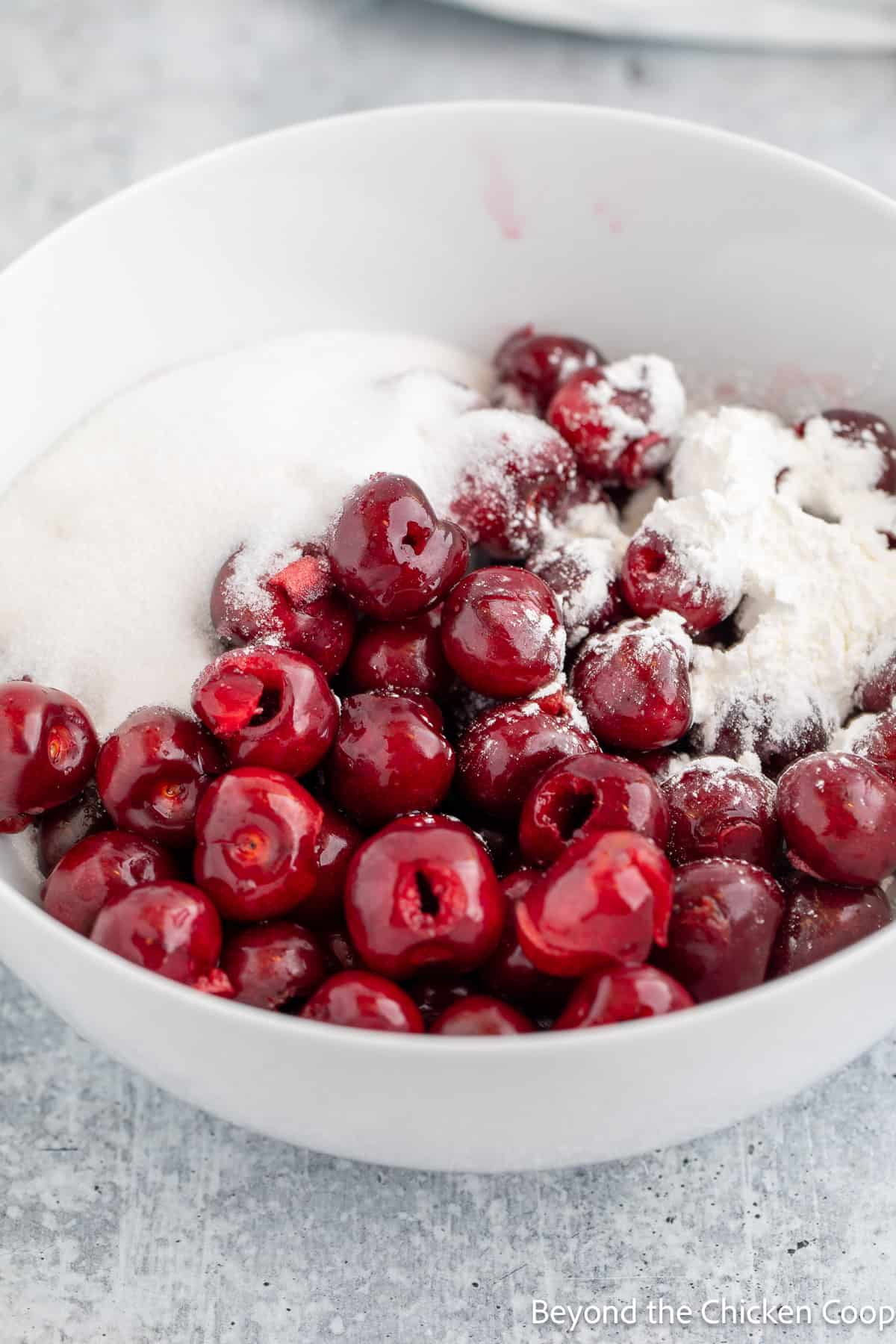 Sugar and cherries in a bowl. 