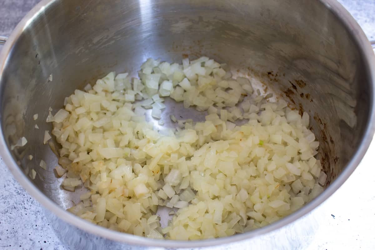Cooked onions in a large pot.