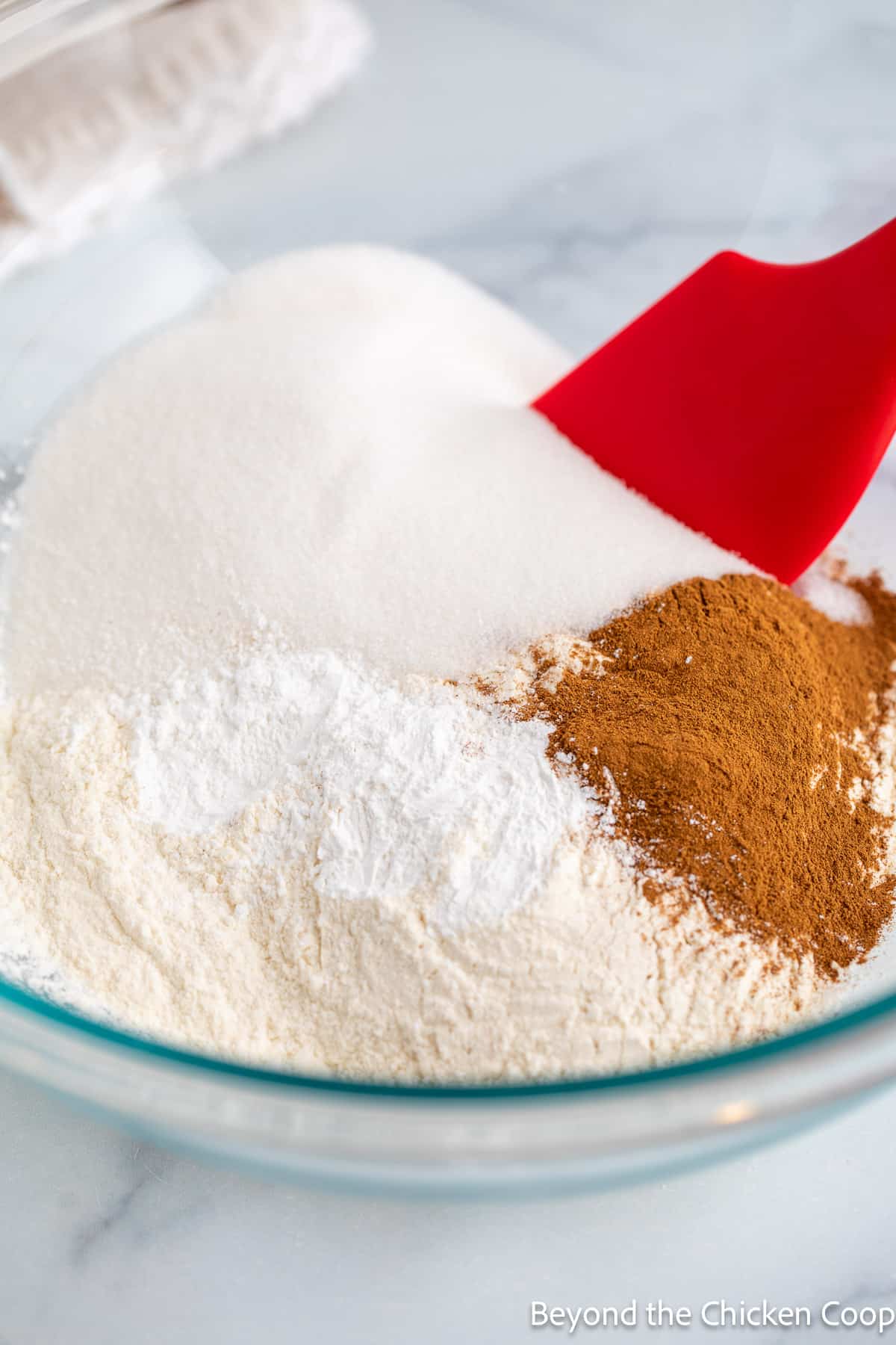 Flour, sugar and cinnamon in a bowl. 