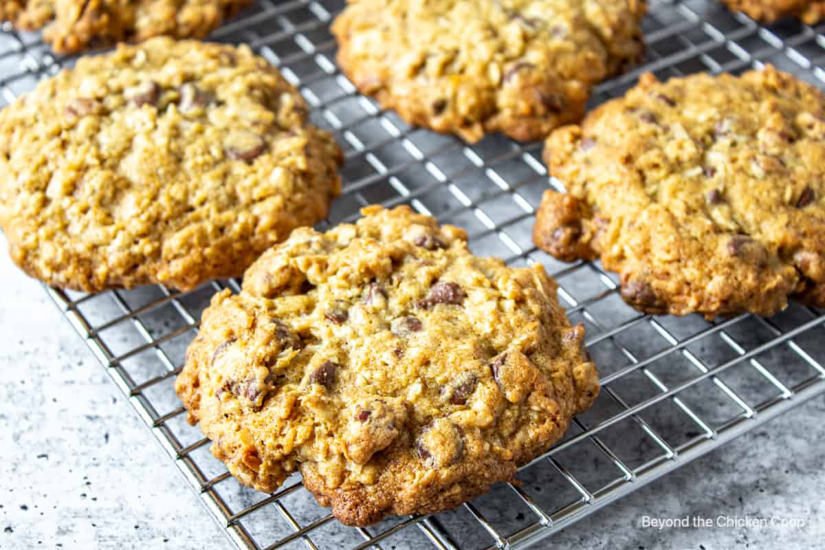 Cowboy cookies on a baking rack.