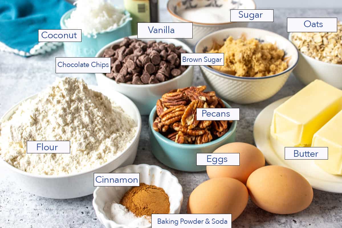 Small bowls and plates filled with ingredients for making cookies.