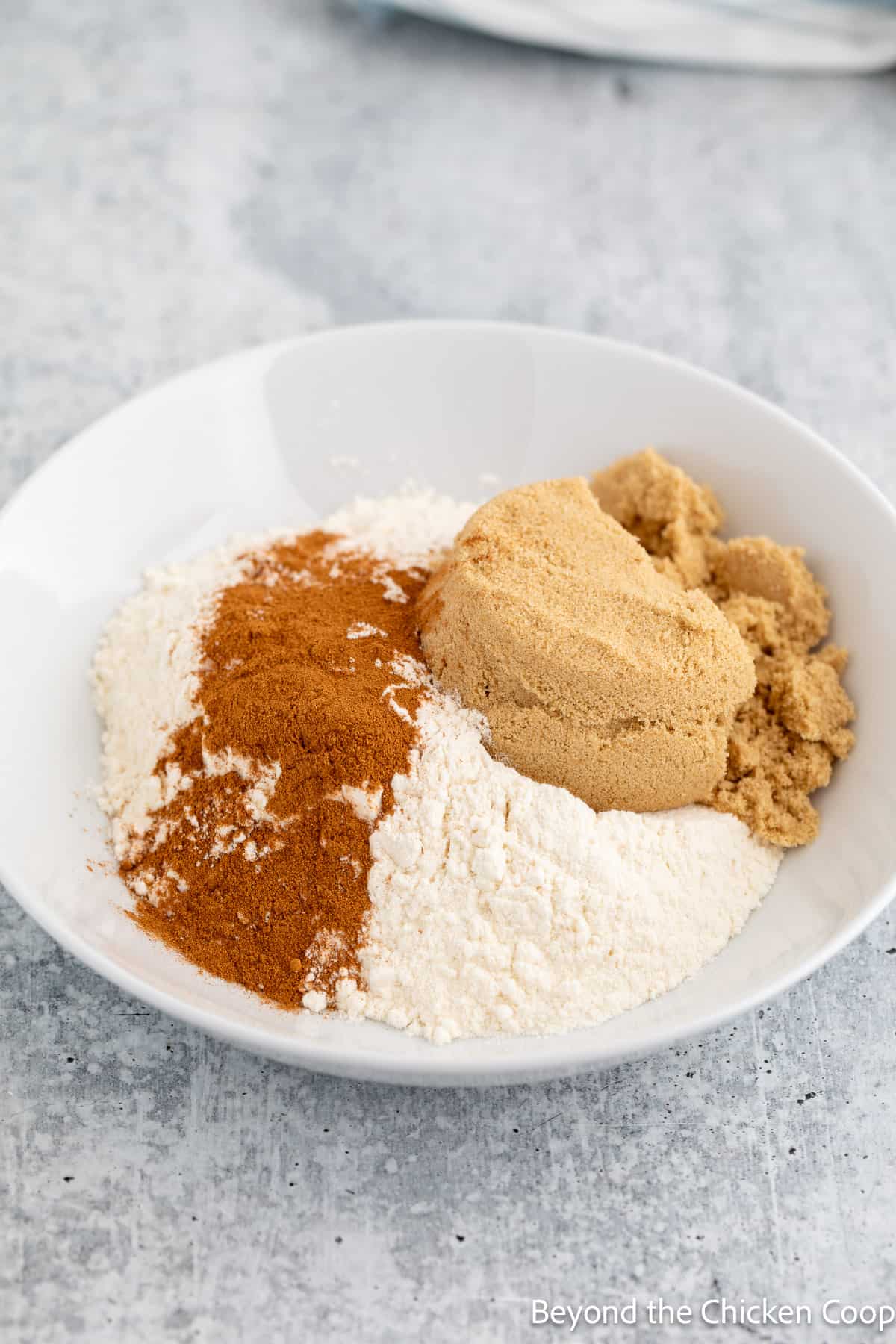 Flour, brown sugar and cinnamon in a bowl. 