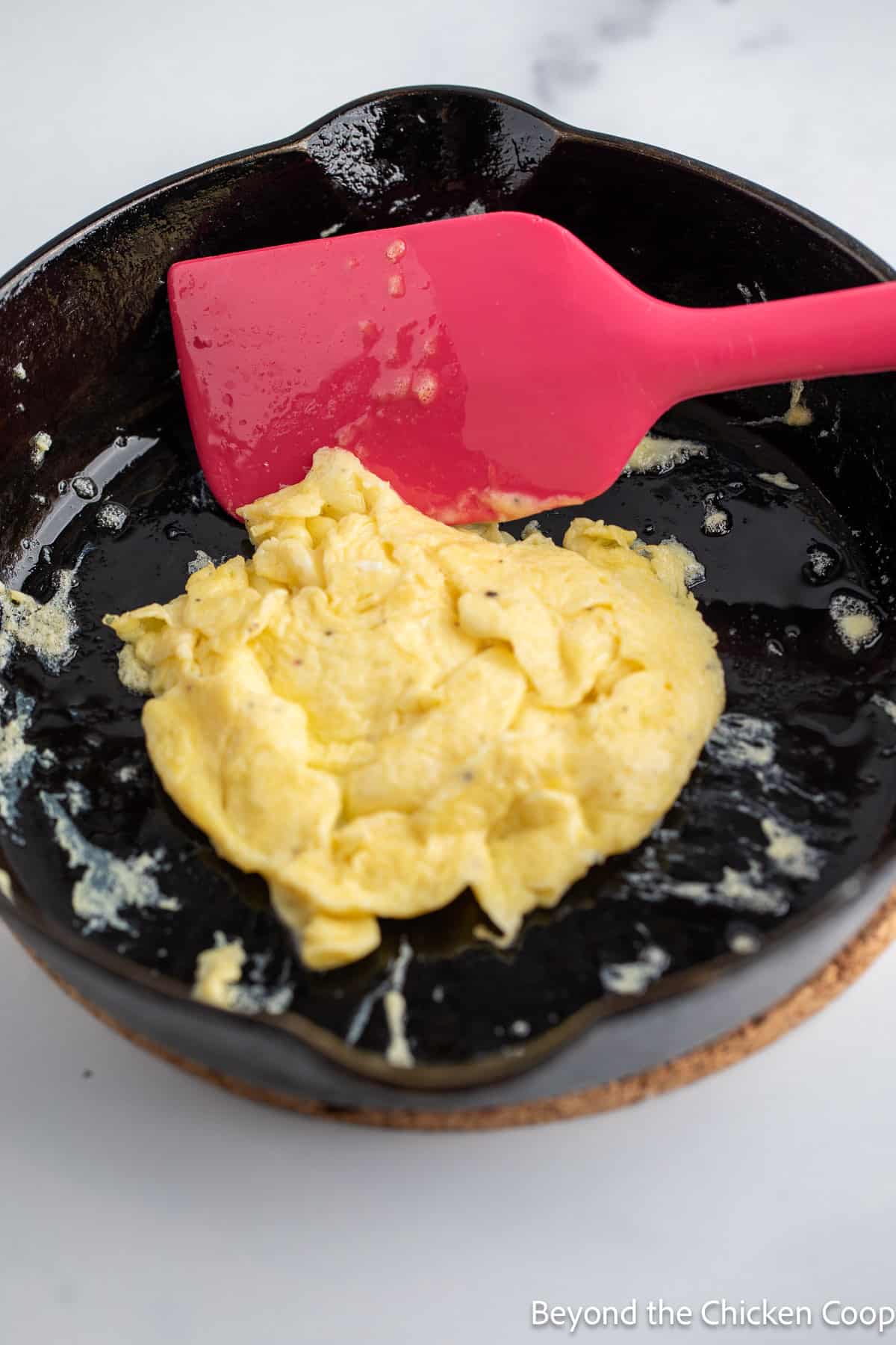 Make a scrambled egg patty. 
