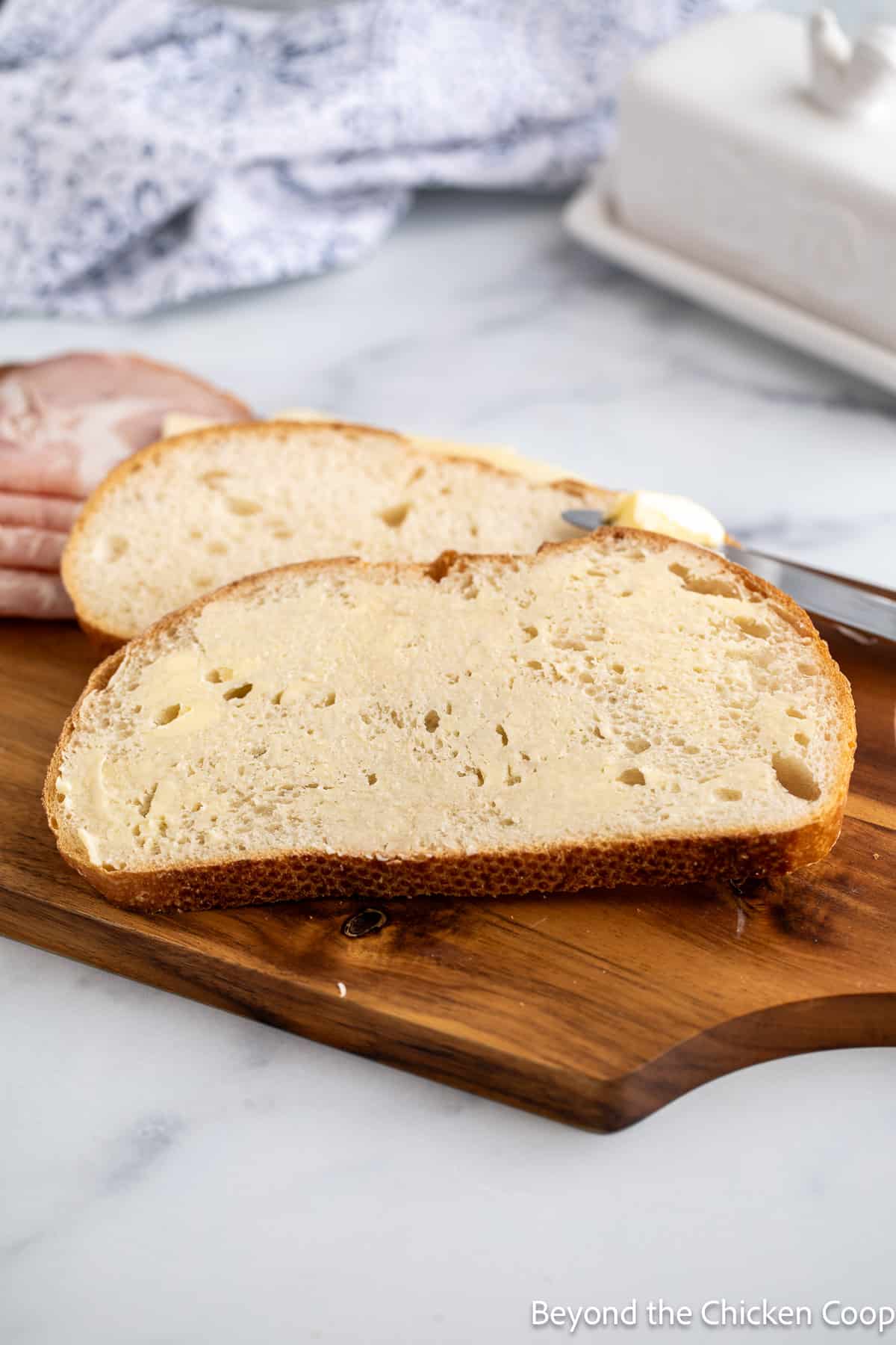 Buttering slices of bread. 