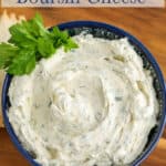 Boursin cheese in a blue bowl.
