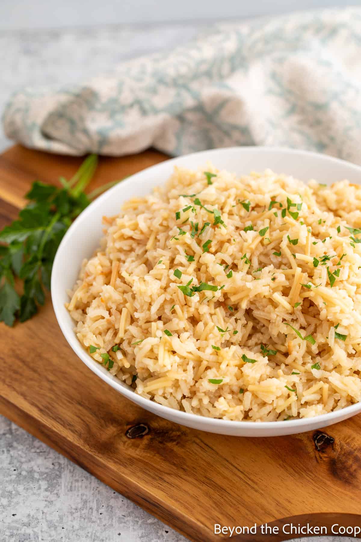 A white bowl filled with rice. 