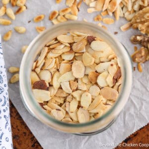 Toasted almonds in a glass jar.