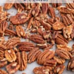 Pecans on a baking sheet.