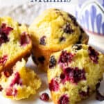 Muffins filled with berries on a white plate.