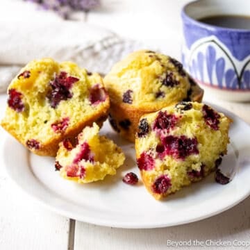 Huckleberry muffin on a plate.