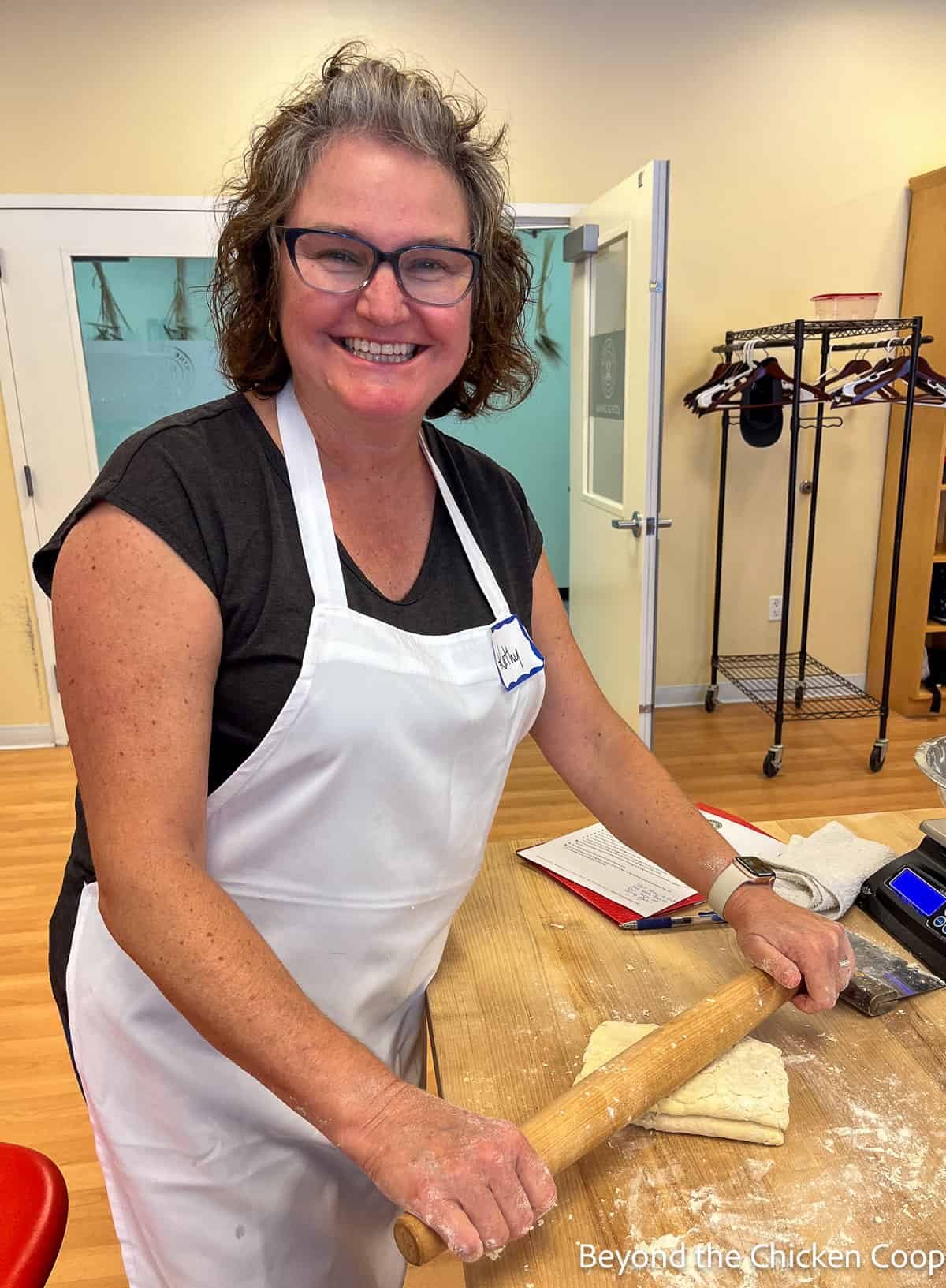 Kathy rolling out puff pastry. 