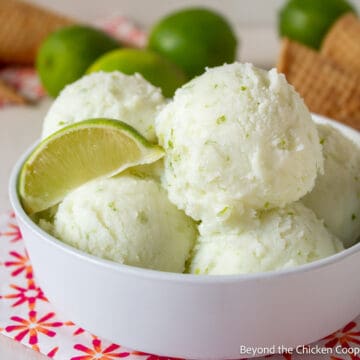 Scoops of lime sherbet in a white bowl.