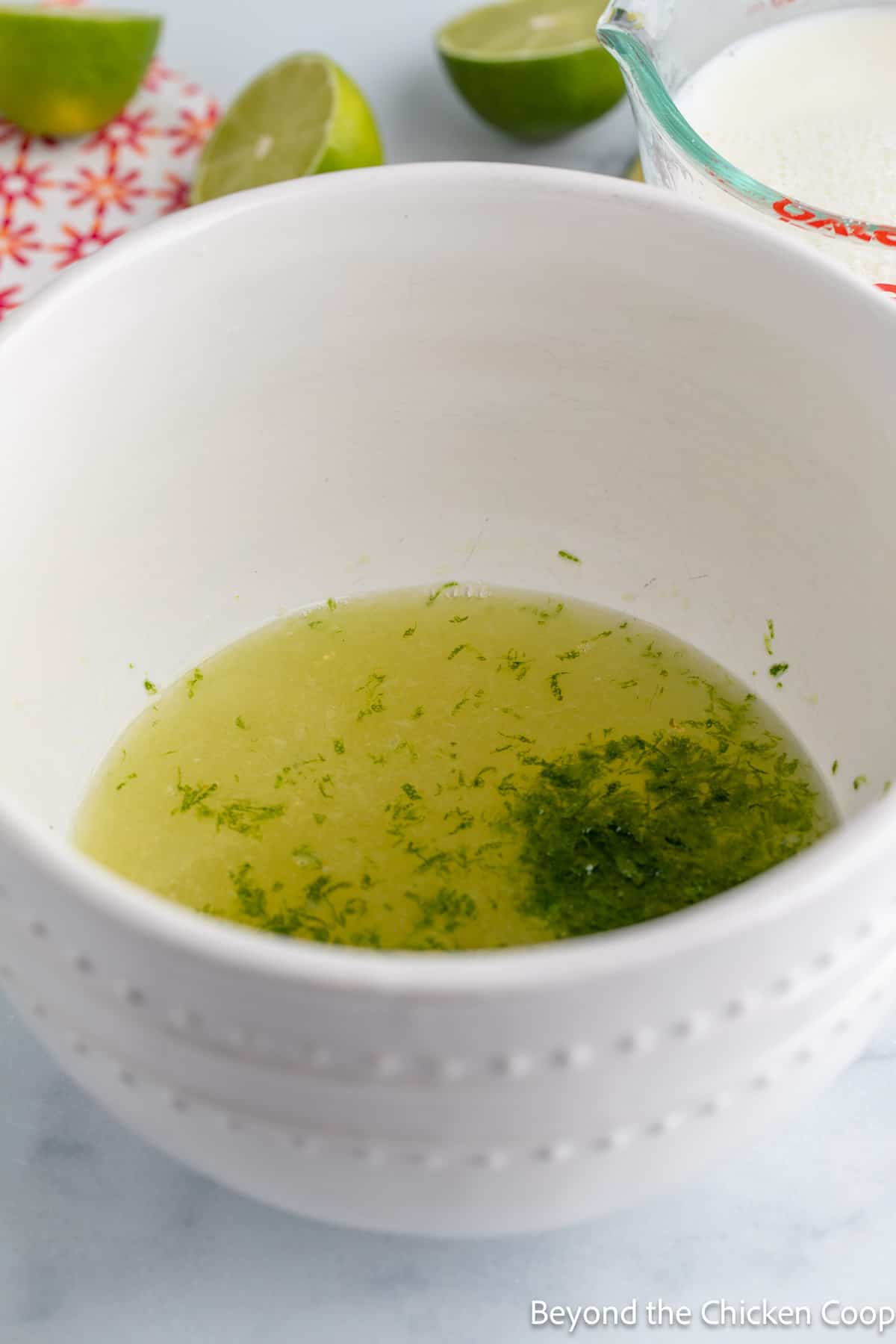 Lime zest and juice in a bowl. 