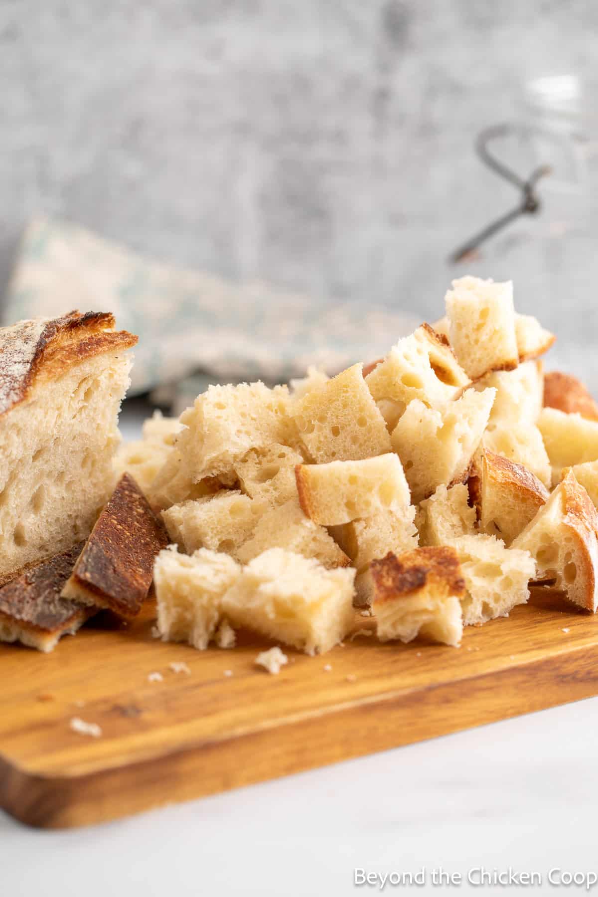 Cut bread cubes on a board. 