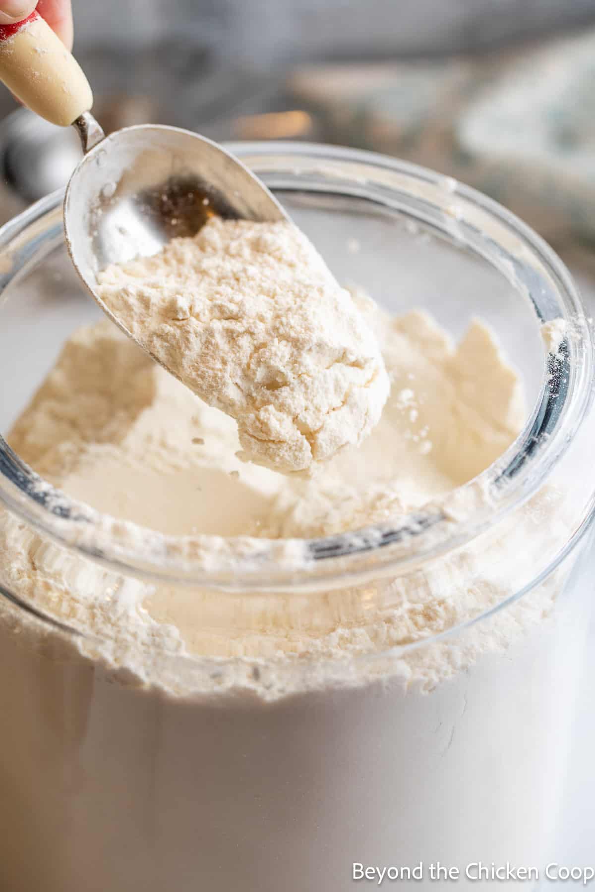 A scoop in a jar of flour. 