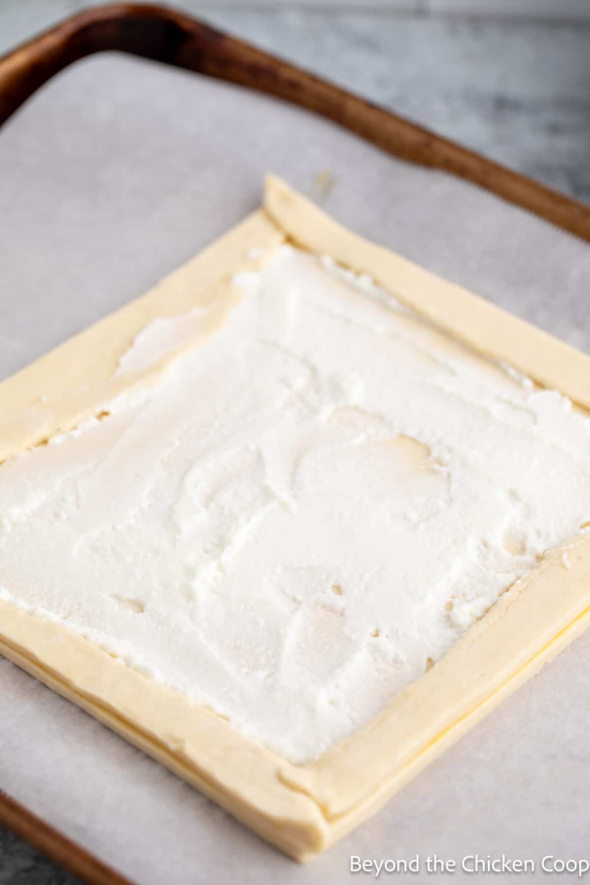 Puff pastry topped with a layer of yogurt.