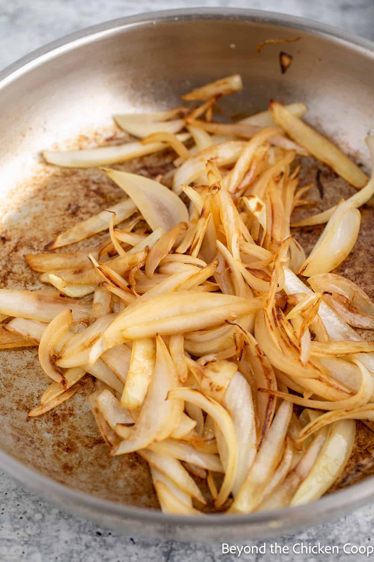 Cooked onions in a pan. 