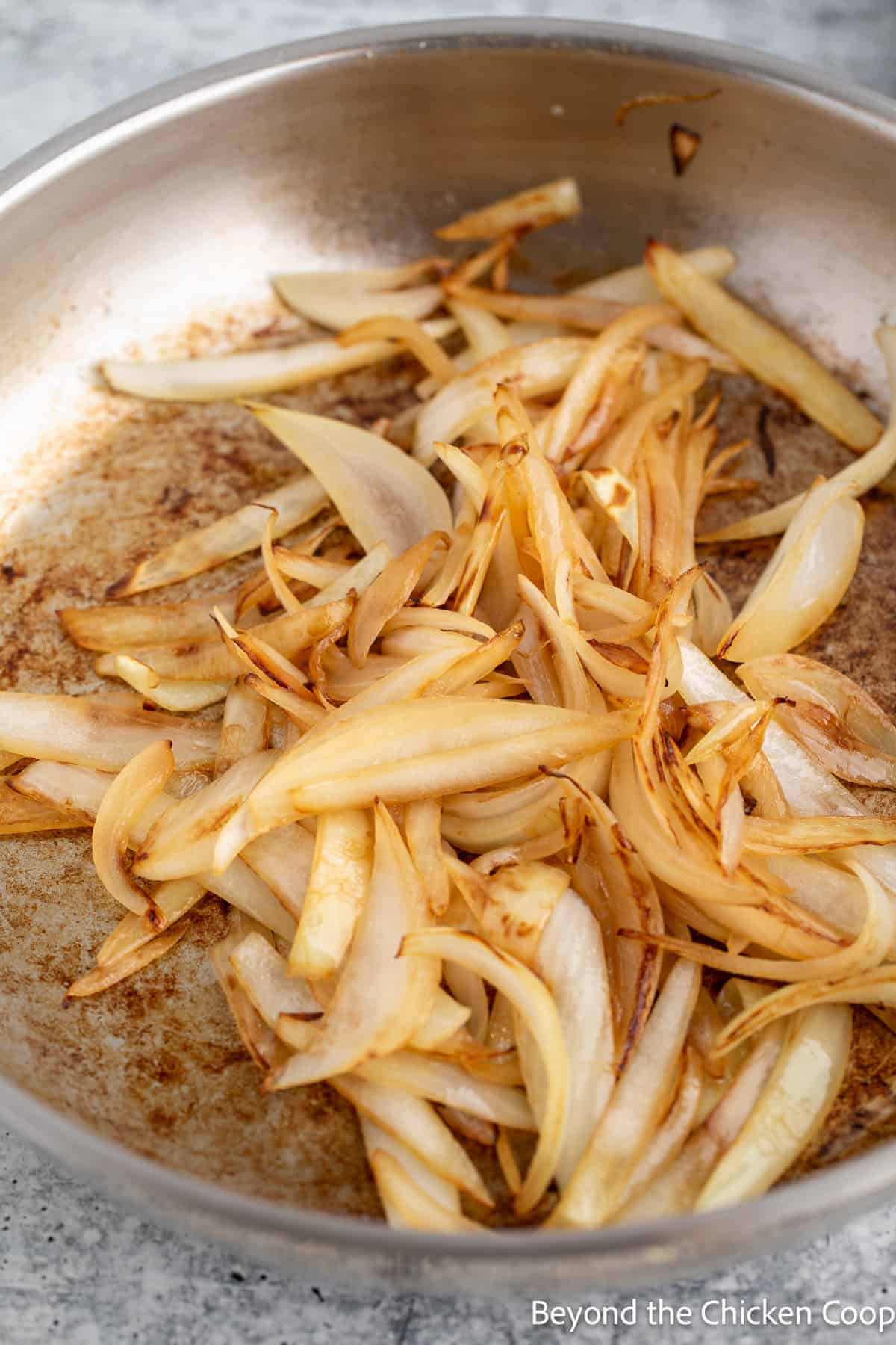 Cooked onions in a pan.