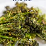 Roasted broccoli florets on a plate.